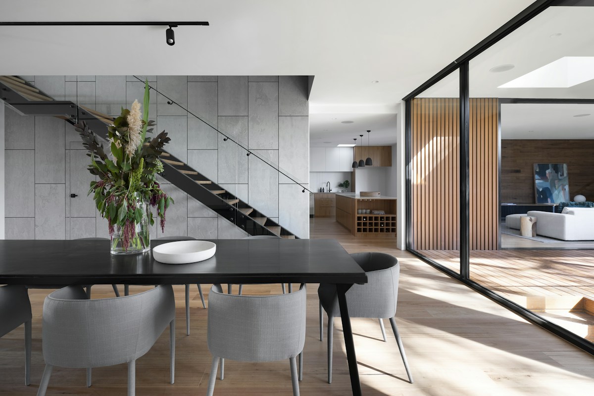 Modern home opening onto a green outdoor space